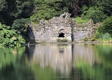 Ruins by lake with heron