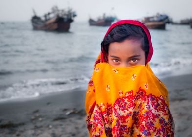 Girl in orange on a beach