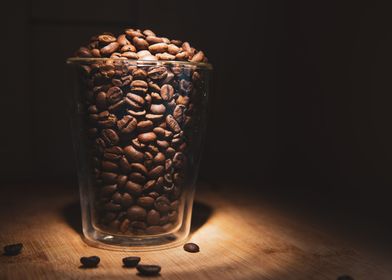 Coffee beans in glass cup 