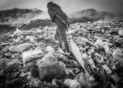 Woman work at dump site