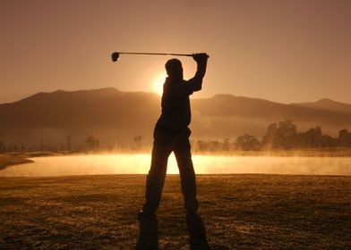 Playing golf at sunrise