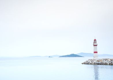 Lighthouse in a foggy sea