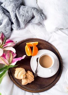 cup of coffee on a bed