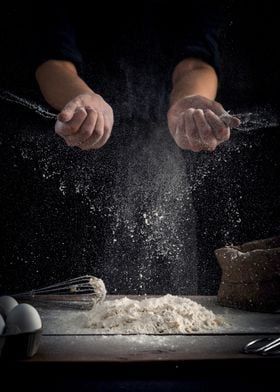 Baker Tossing Flour