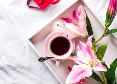 tray with cup of hot tea 