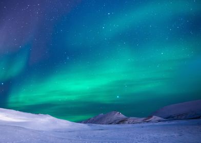 Aurora Behind Snowy Hills