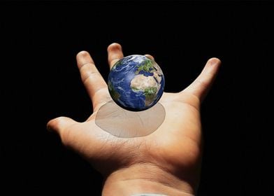 Hand and earth globe