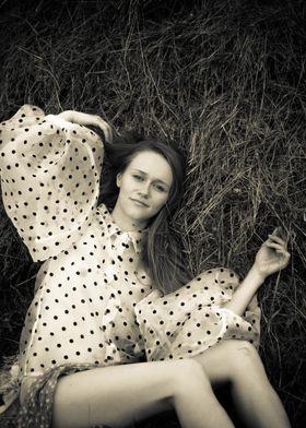 Young woman in a haystack