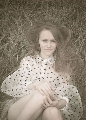 Young woman in a haystack