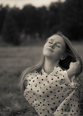 Young woman in a haystack