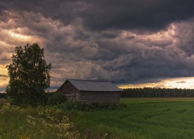 A Barn and Storm Clouds