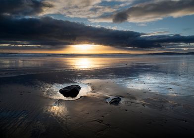 Sunset and wet sand