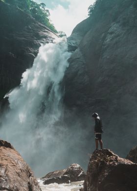 Man front of waterfalls