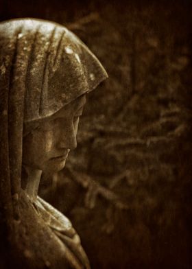 Grieving cemetery statue 