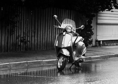 Scooter Parked In The Rain
