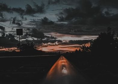 road and dark clouds