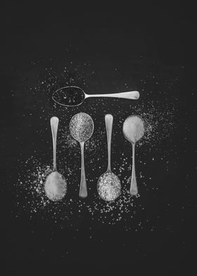 Spices on silver spoons 