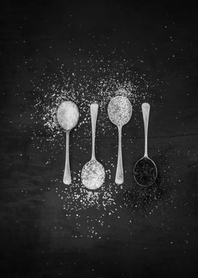 Spices on silver spoons 