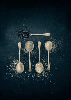 Spices on silver spoons 