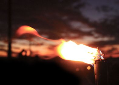 A Burning Torch At Sundown