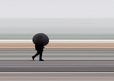 Man in rain with umbrella