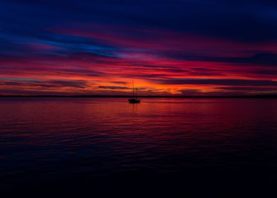 Sunset with boat on lake