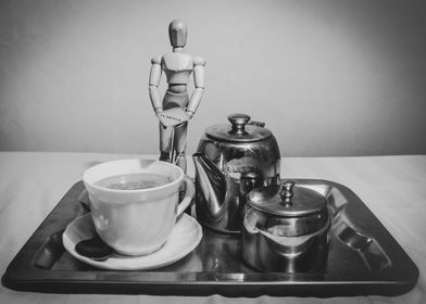 Manikin having tea