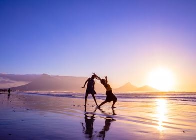 Women dancing on beach