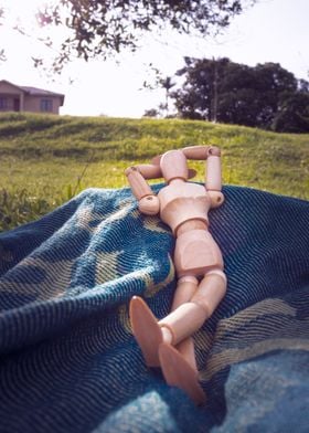 Manikin relaxing outdoors