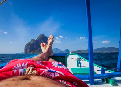 Man Laying In Banca Boat F