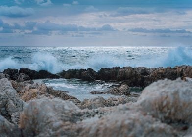 Waves Splashing Against Ro