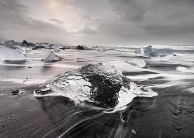 Ice block on black beach