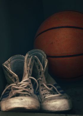 Vintage sneakers and ball