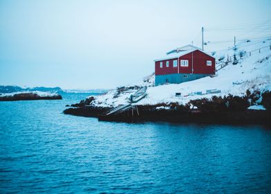 Snow covered red house