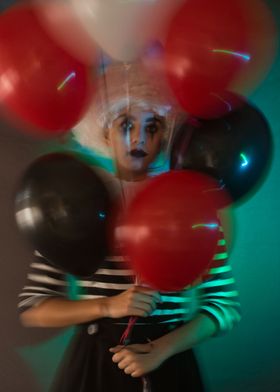 Colored balloons and clown
