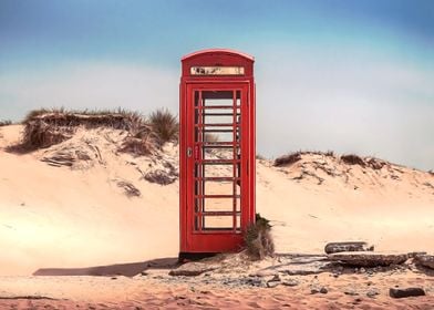 Red telephone box on a des