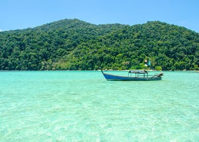  long tail boat on sea