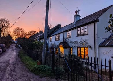 Sunset over a cottage