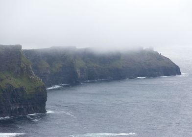 Misty cliffside