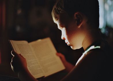 boy child ridding book