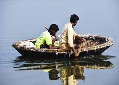 A bot and bot men in river