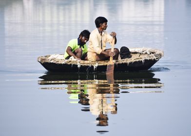 A bot and bot men in river