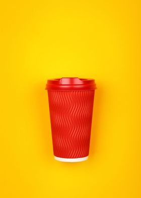 Red coffee cup on yellow