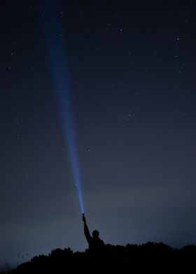 Flashlight in Night Sky