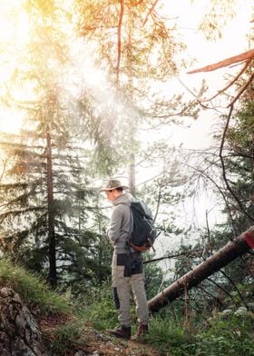 Hiker in morning forest