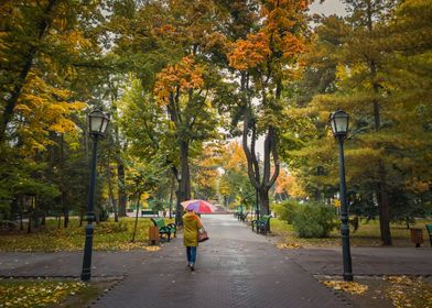 woman walks in autumn park