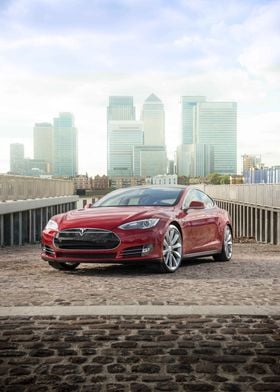 Red Tesla Model S in city