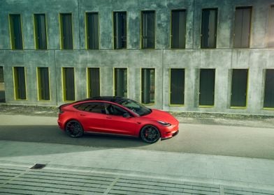 Red Tesla model Y parked