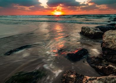 Dark Sun sea Israel rocks