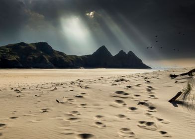 light on Three Cliffs Bay